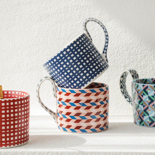 Large capacity ceramic cup with geometric checkered pattern.