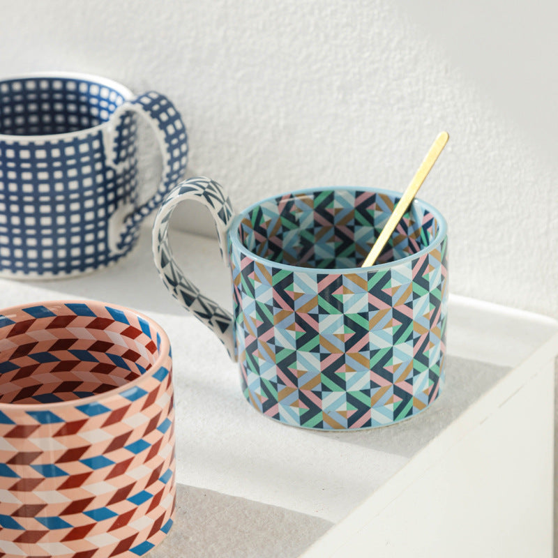 Large capacity ceramic cup with geometric checkered pattern.