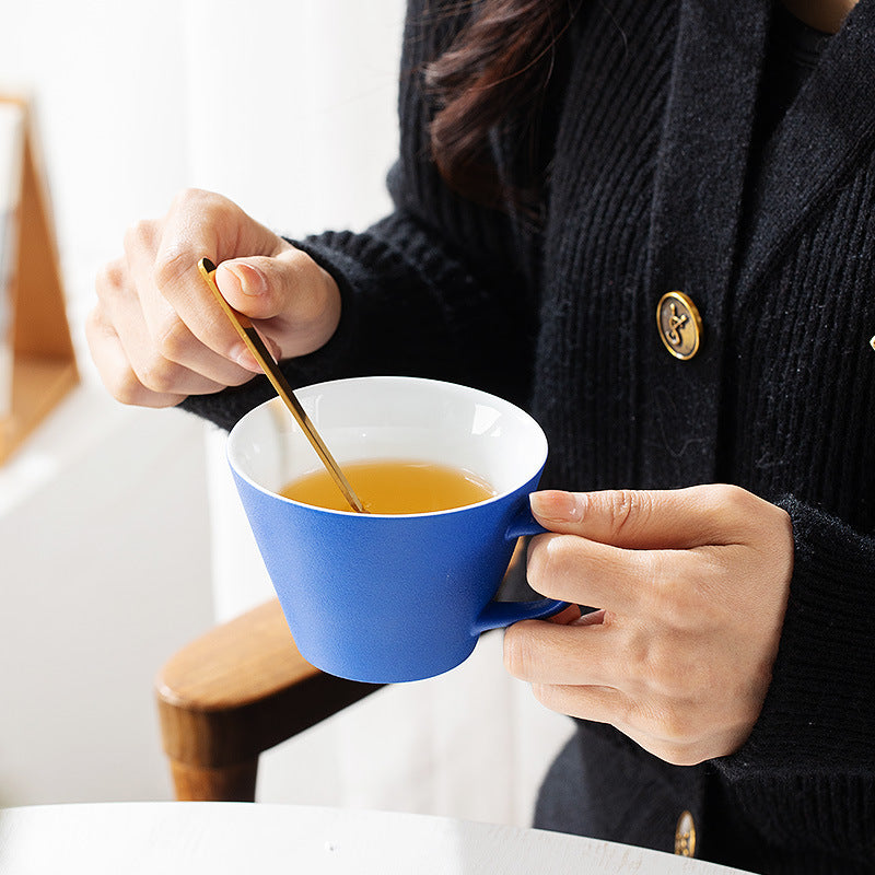 Handmade Klein blue horseshoe-shaped coffee cup for home.