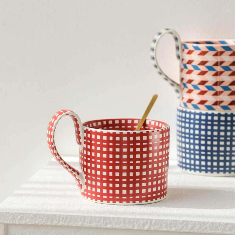 Large capacity ceramic cup with geometric checkered pattern.